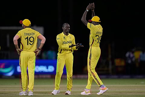 Cosmas Kyewuta celebrates Ibrahim Zadran's wicket